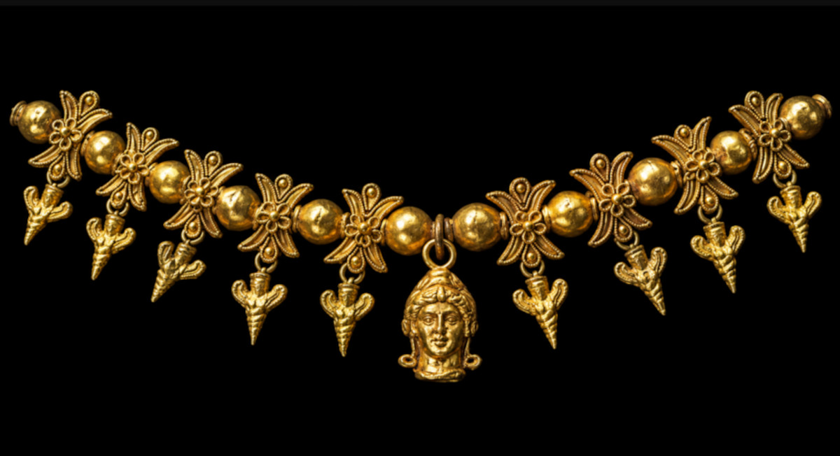 A gold necklace not proved to show bee-women