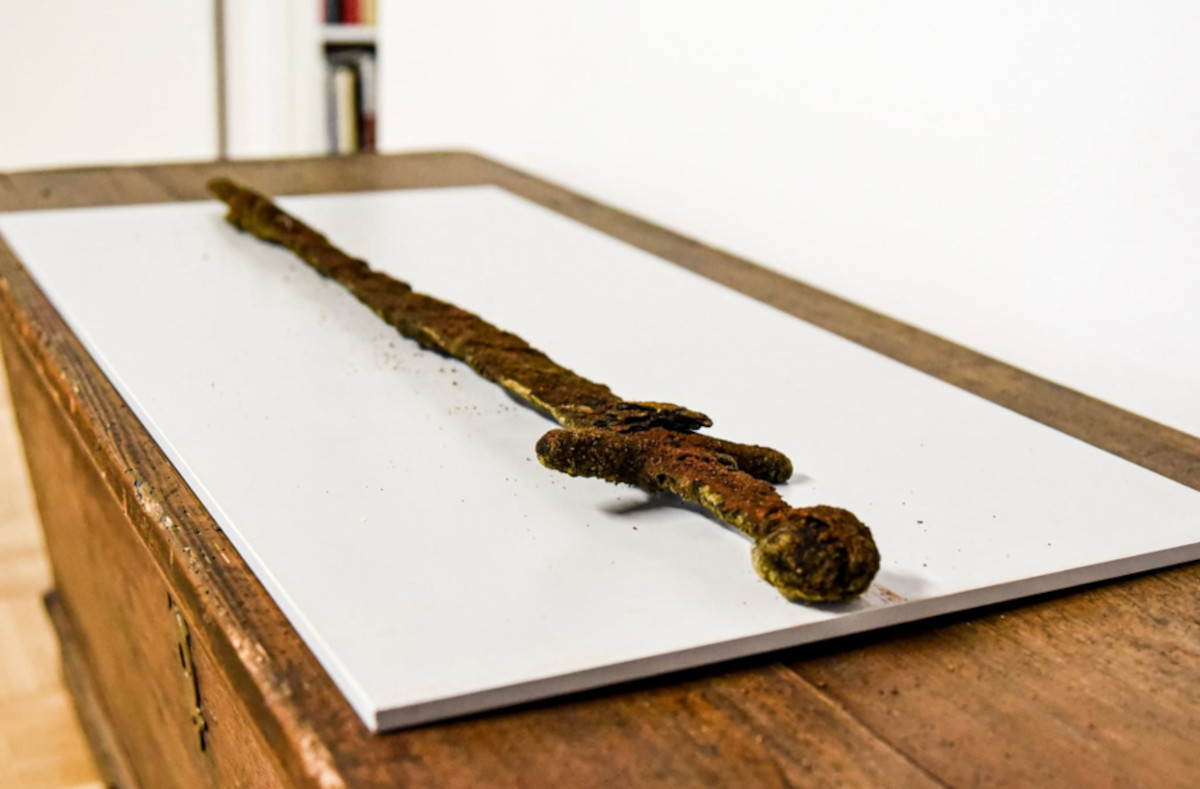 A sword pulled from a river