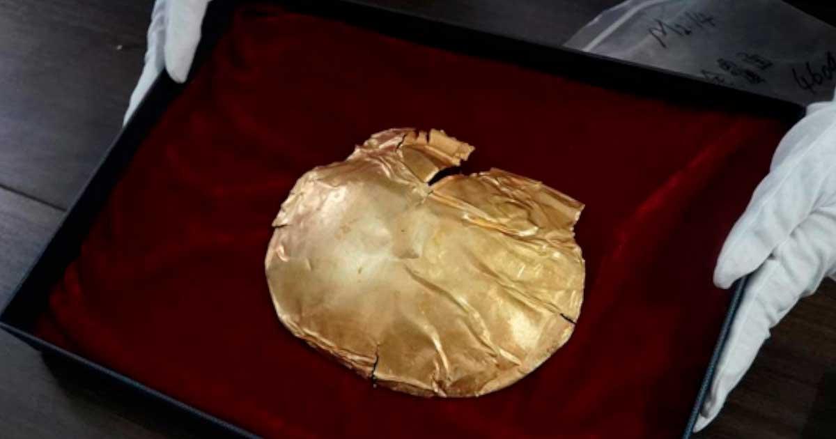 A gold mask in a noble's tomb.