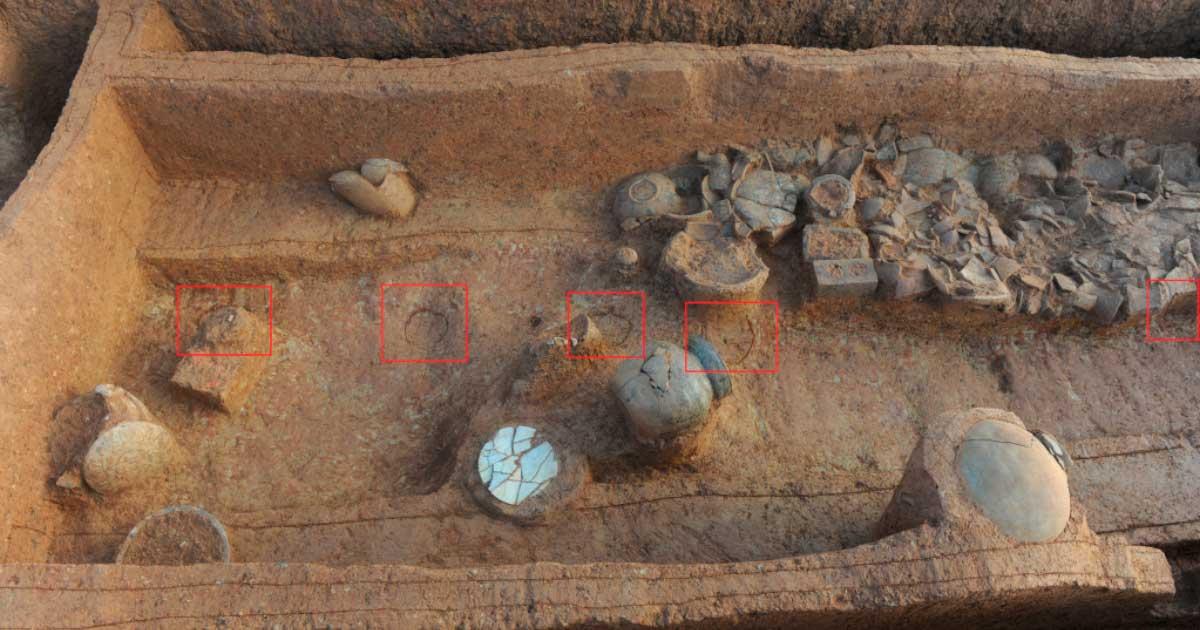 Tombs full of pottery on a mountainside.