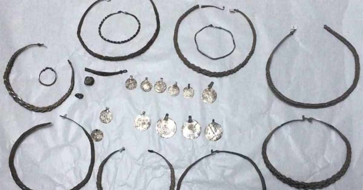 Silver rings hidden under a floor.